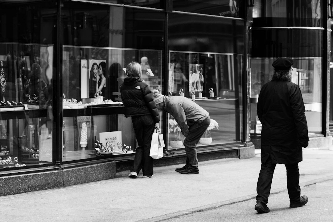 store detective watching shoppers
