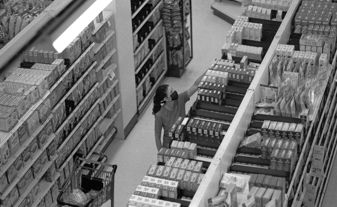 retail security officer monitoring aisle